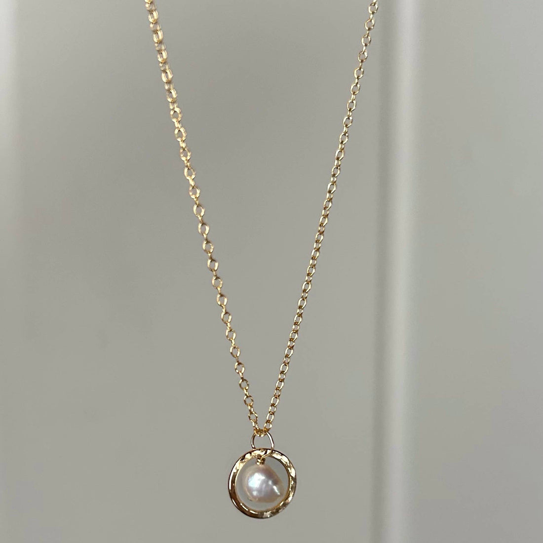 Gold necklace with a pearl pendant