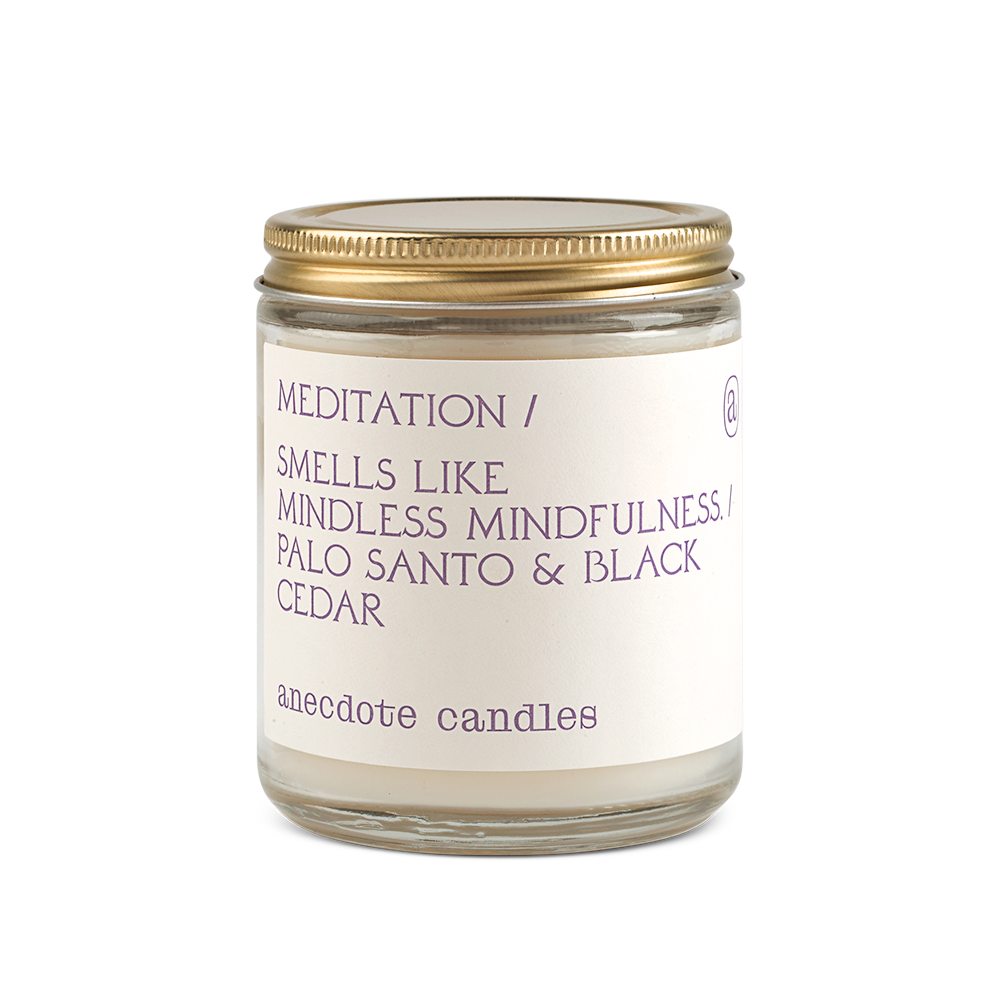 meditation candle with palo santo and black cedar scent notes 