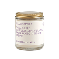 meditation candle with palo santo and black cedar scent notes 