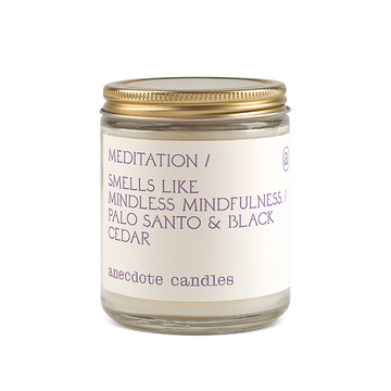 meditation candle with palo santo and black cedar scent notes 