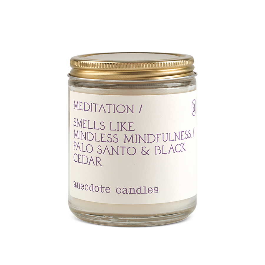 meditation candle with palo santo and black cedar scent notes 