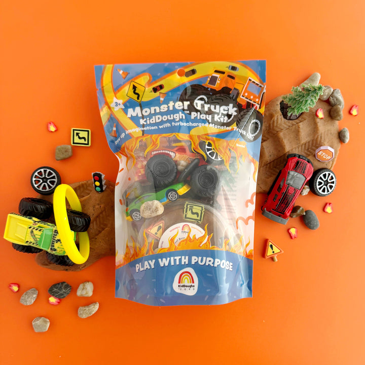 Monster Truck Kiddough Play Kit with toy trucks and accessories.