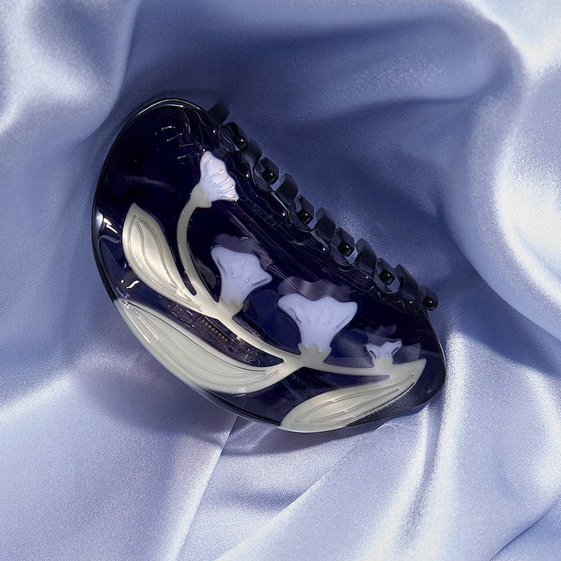 navy hair claw with moonflowers