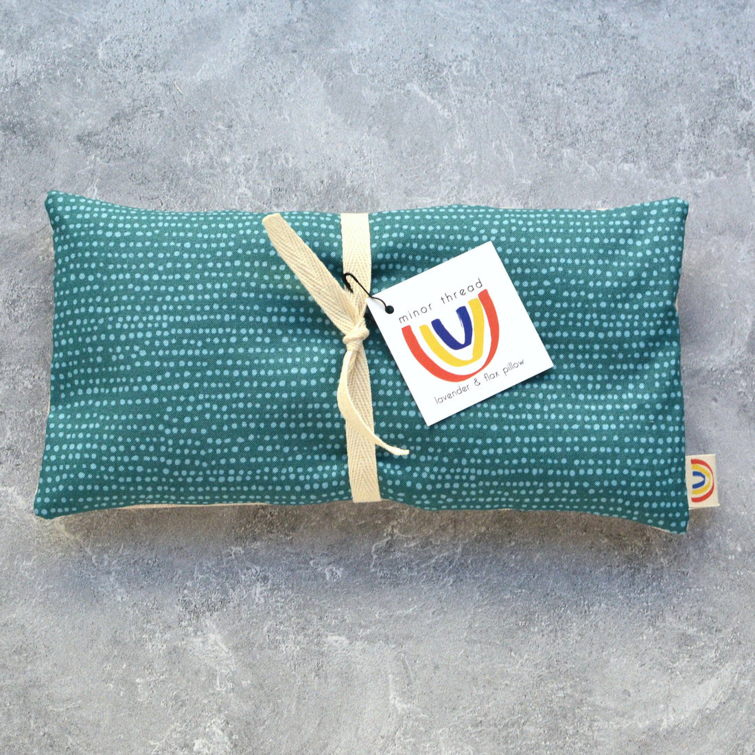 lavender scented eye pillow with teal fabric and flax seeds