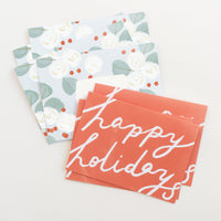 Red Happy holidays card with eucalyptus envelope