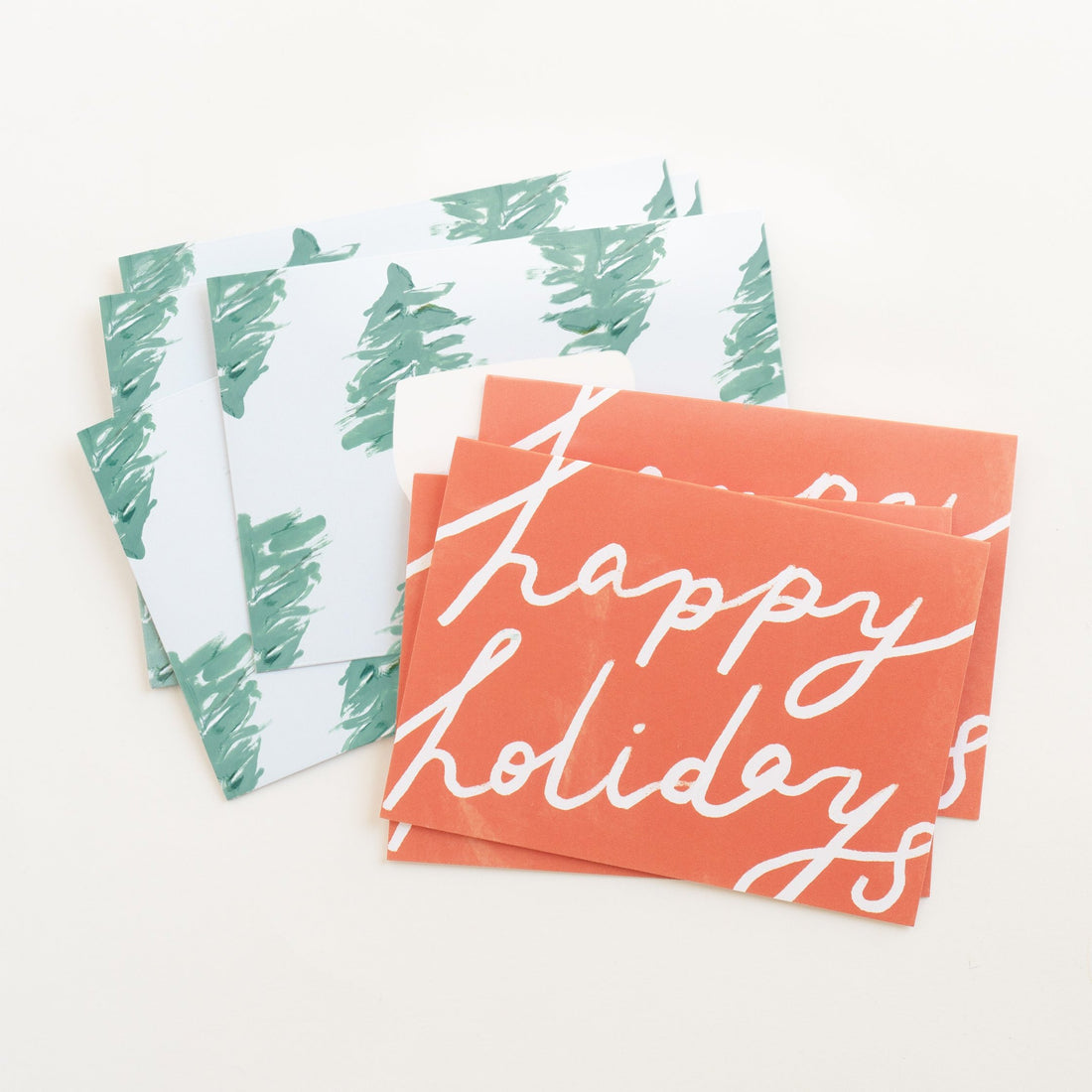 red happy holidays card with spruce envelope 