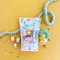 Party time-themed product packaging with toys on a yellow background
