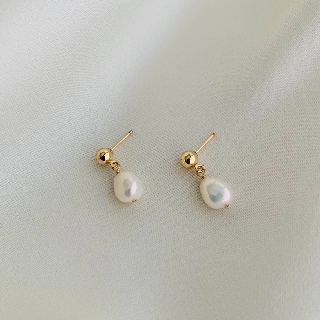 Pair of pearl earrings with gold posts 