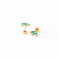 Gold turtle earrings with green accents 