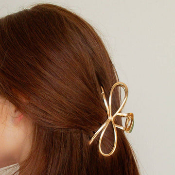 gold bow shaped claw clip 