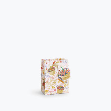 gift bag with birthday cake and and confetti