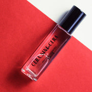 roll on perfume oil with notes of Saffron, Almond, Jasmine, Fir Resin, Amberwood