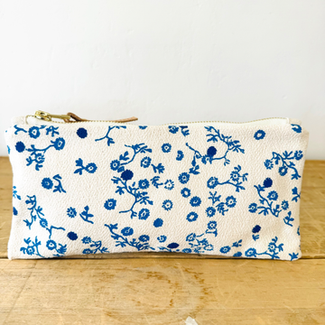 white and blue floral patterned pencil pouch 