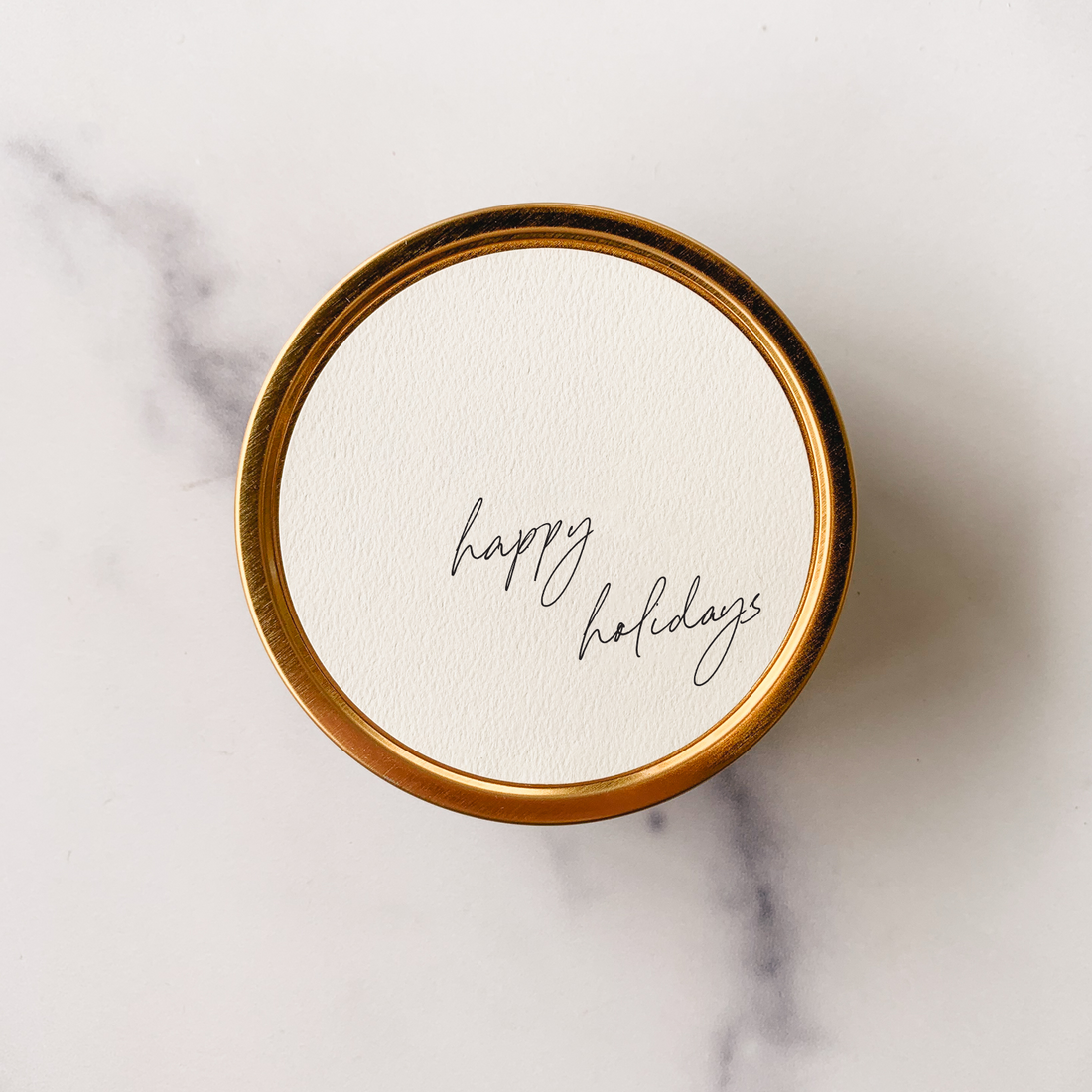 happy holidays lettering in travel tin 