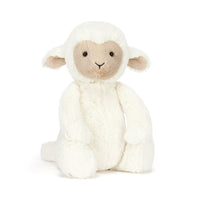 Stuffed toy lamb with white fleece and beige face 