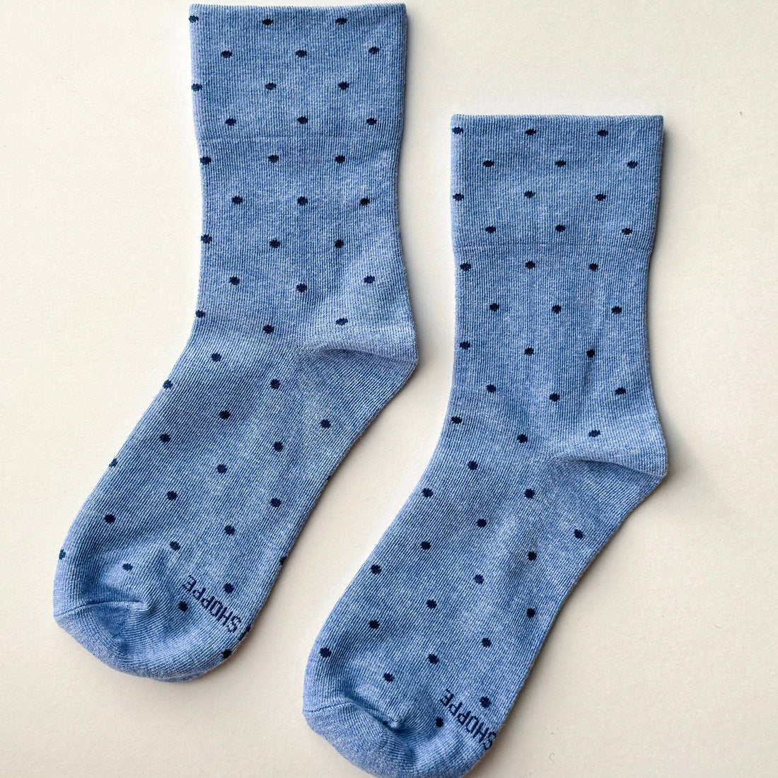 light blue socks with navy polka dots 