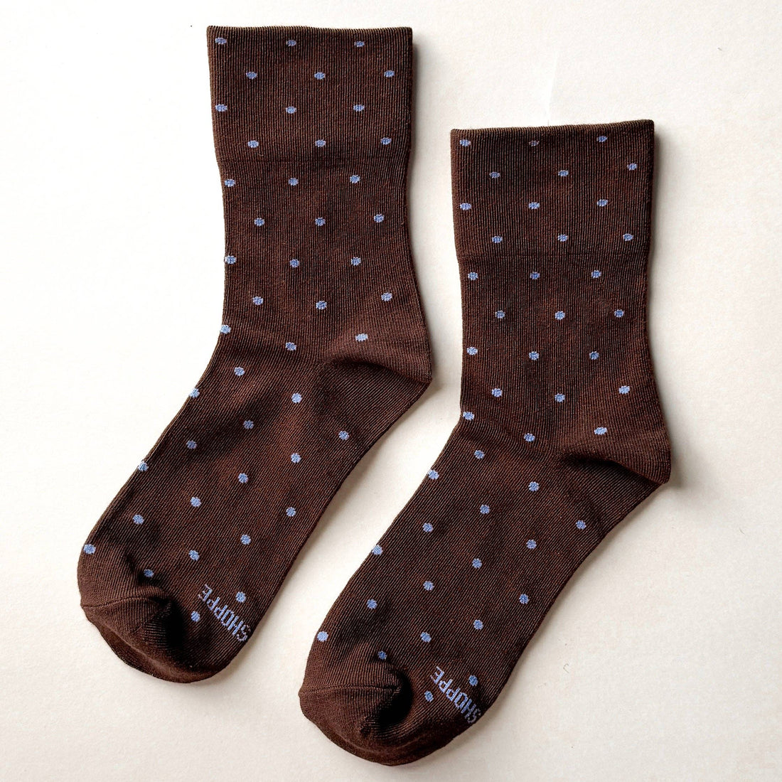brown socks with light blue polka dots