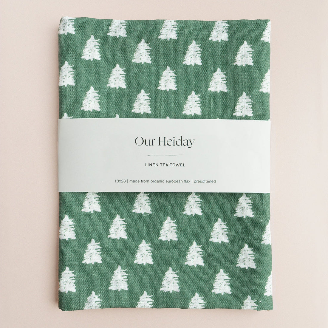 hunter green holiday linen tea towel with painterly white trees