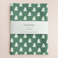 hunter green holiday linen tea towel with painterly white trees