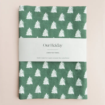 hunter green holiday linen tea towel with painterly white trees