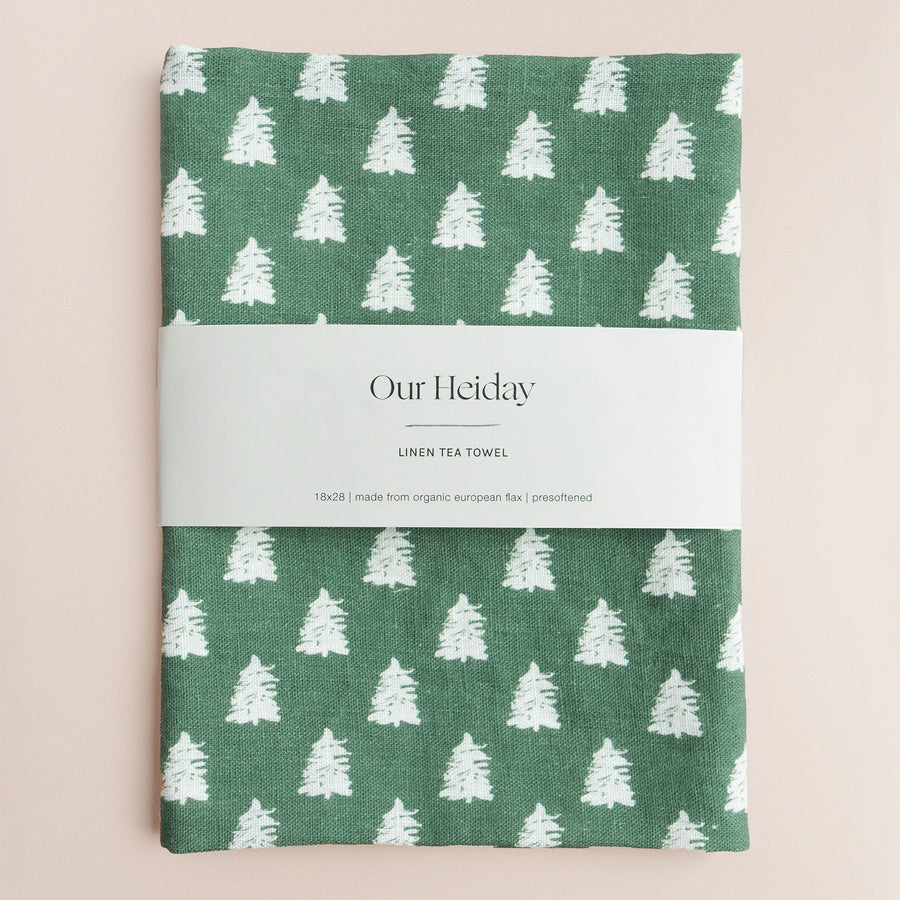 hunter green holiday linen tea towel with painterly white trees