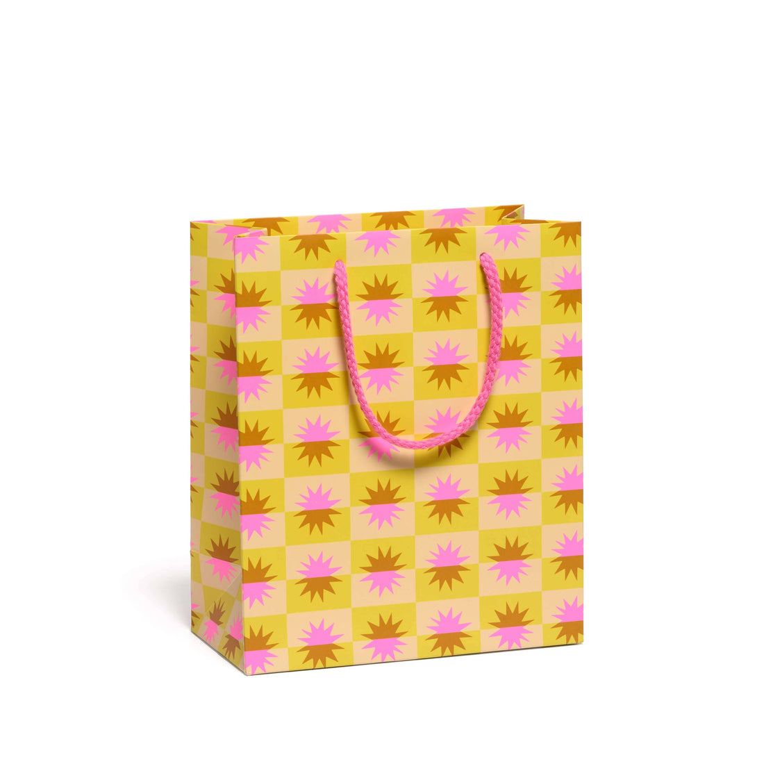 Yellow and pink patterned gift bag with sunbursts