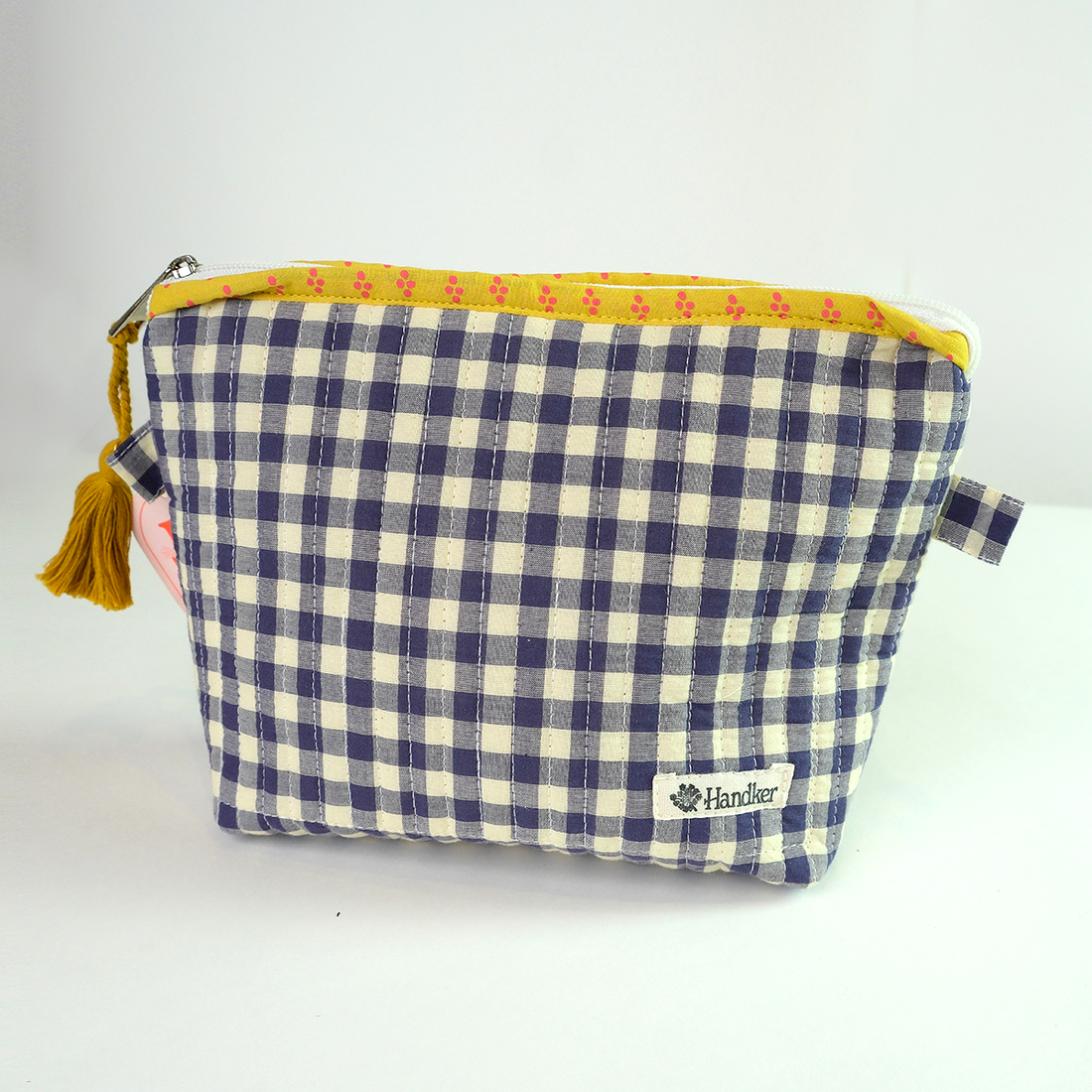Blue and white checkered pouch with yellow trim and tassel 