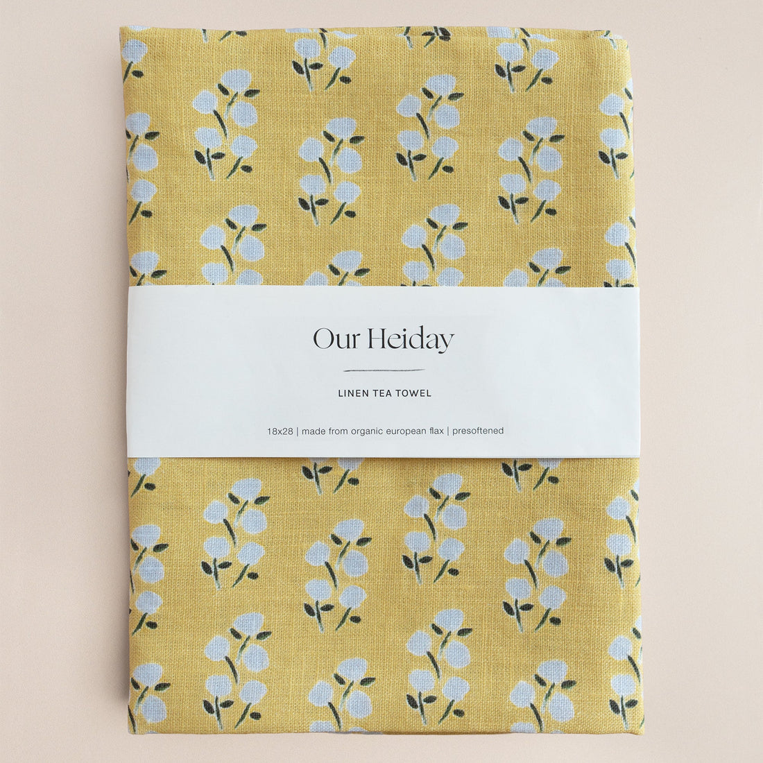 Yellow linen tea towel with floral pattern 