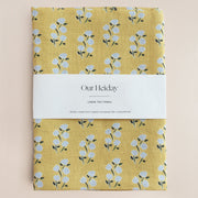 Yellow linen tea towel with floral pattern 