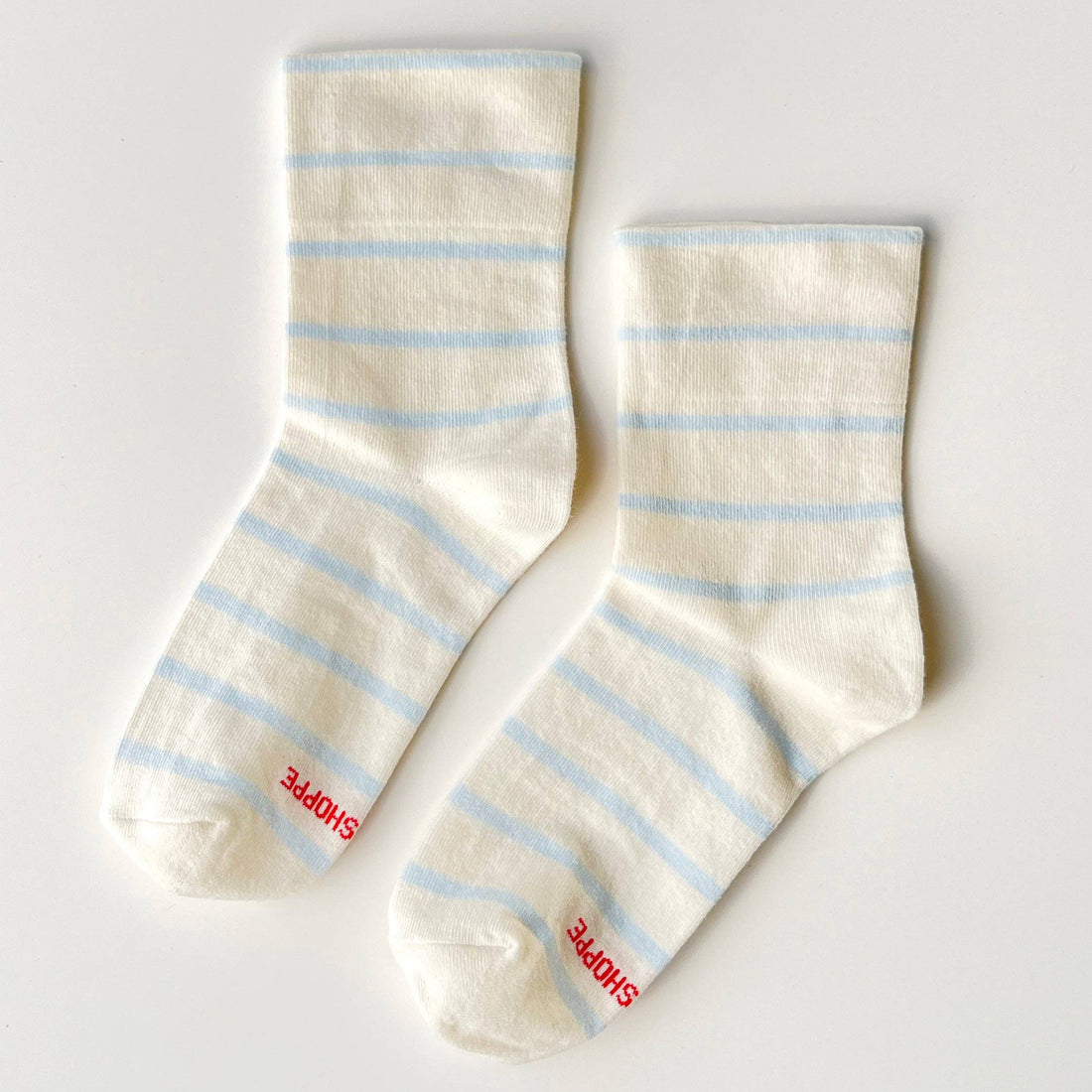 Pair of cream socks with blue stripes 