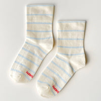 Pair of cream socks with blue stripes 
