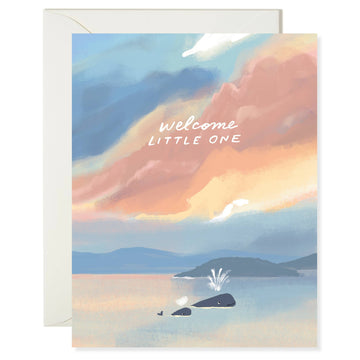 Greeting card with a scenic illustration of a mom and baby whale with "welcome little one" text