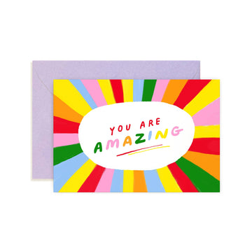 a colorful mini black note card with "you are amazing" text 