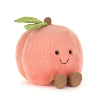 Plush toy peach with a smiling face 