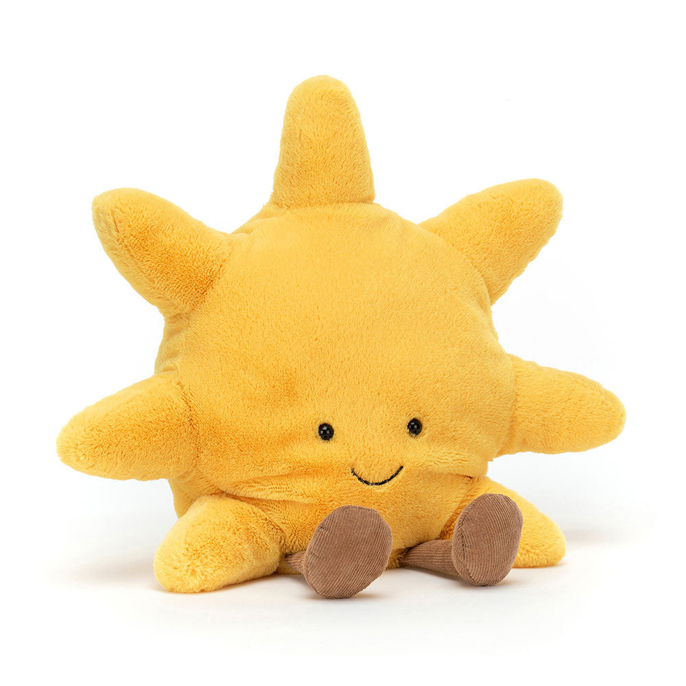 Yellow plush sun toy with a smiling face 