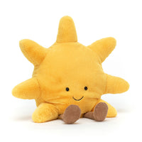 Yellow plush sun toy with a smiling face 