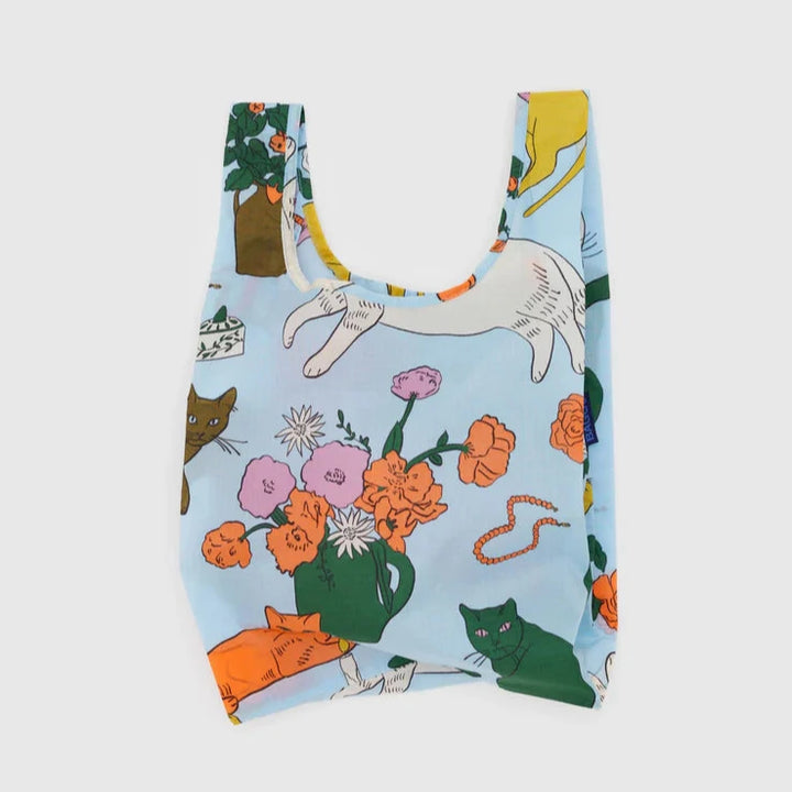 Baby baggu with different colored cats and flowers