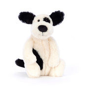 Plush cream toy dog with black spots