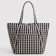 A black and white gingham check canvas tote bag with dual shoulder straps, shown against a plain light gray background.