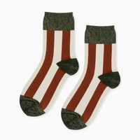 Pair of socks with brown and white horizontal stripes, green heels, and toes 