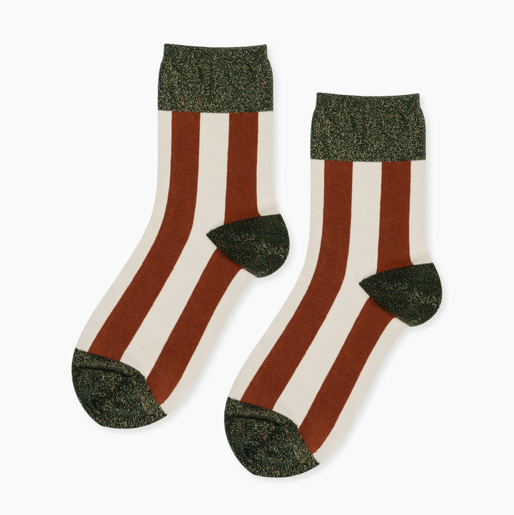 Pair of socks with brown and white horizontal stripes, green heels, and toes 