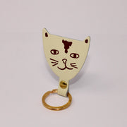 cream cat shaped leather keychain 