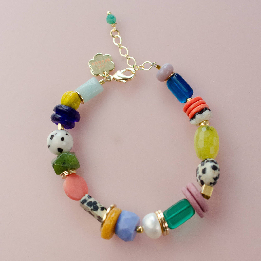Colorful beaded bracelet with gold clasp. 