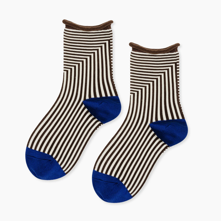 Pair of striped brown and white crew socks with a blue heel and toe