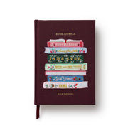 Maroon book journal with book-themed design on a white background