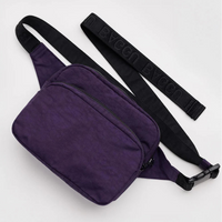 Purple waist bag with a black strap on a light gray background