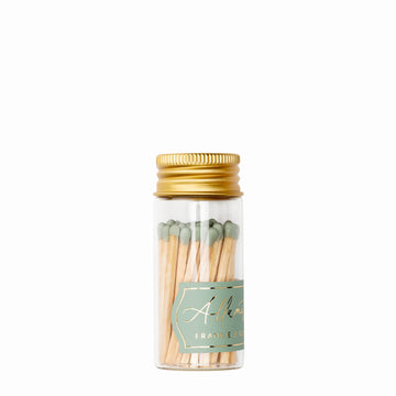 Mini glass match jar with sage green matches and gold lid