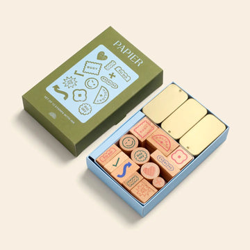 Set of wooden stamps in a box for stationary, notebooks, and organizing 