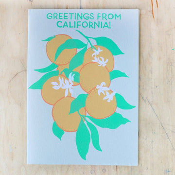Card with oranges and leaves design and 'Greetings from California!' text 