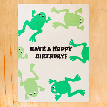 Birthday card with green frogs and 'Have a Hoppy Birthday!' text 
